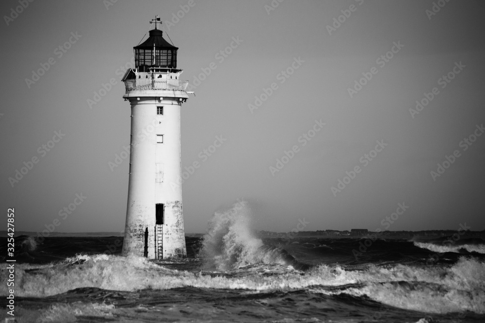 Black and white lighthouse in a storm