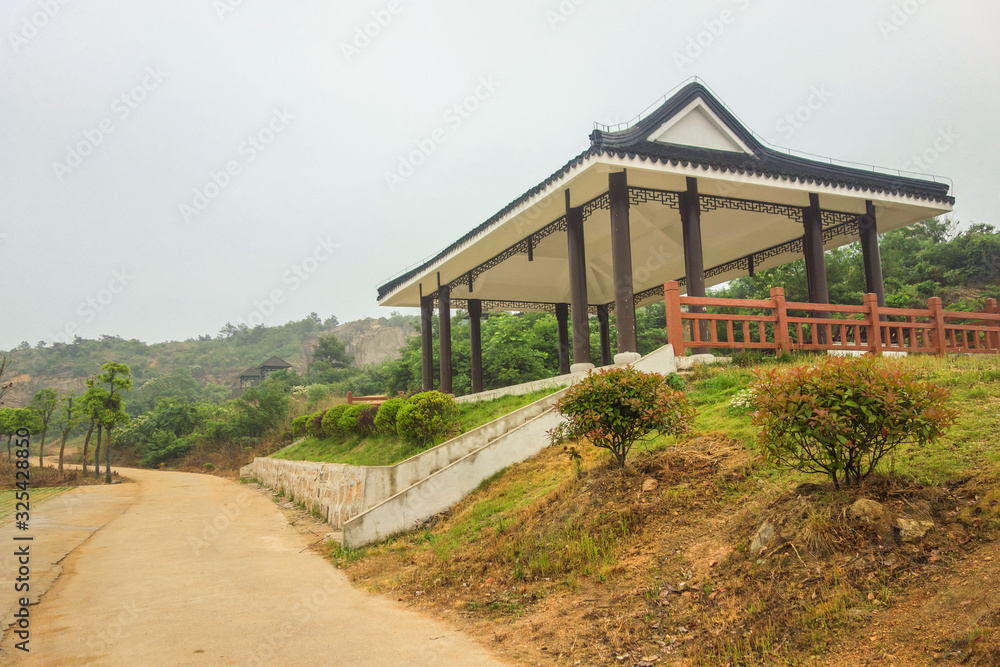 A pavilion on the hillside for tourists to rest A pavilion on the hillside for tourists to rest