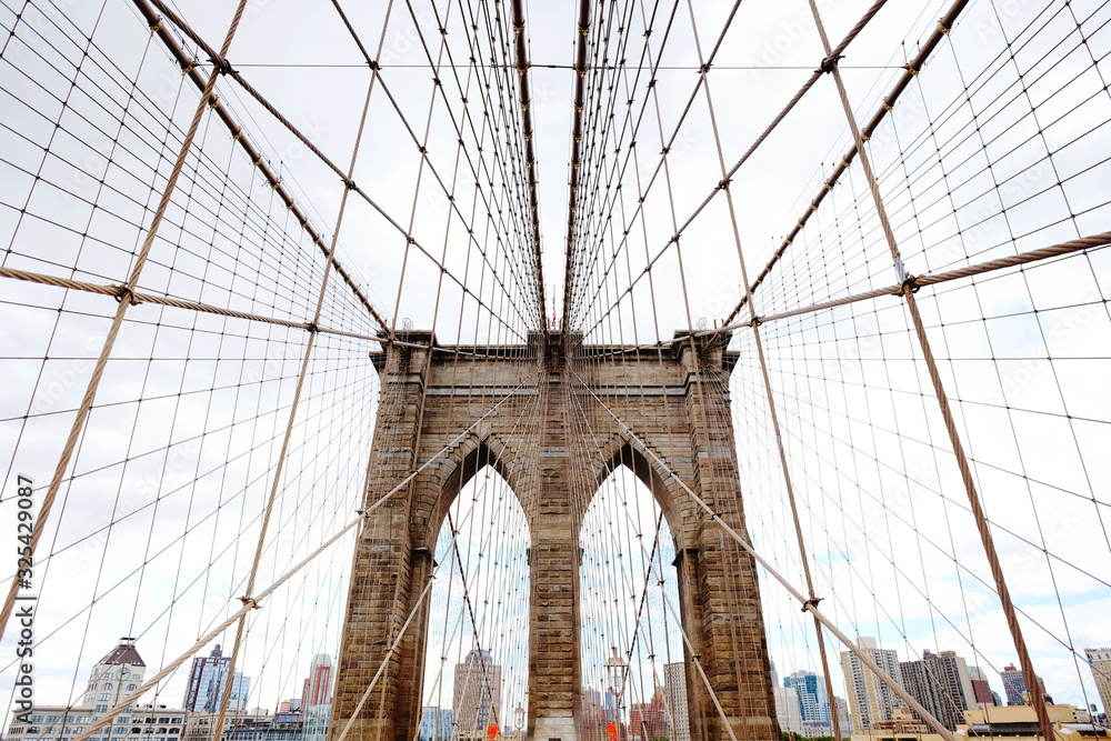 Fototapeta premium Brooklyn Bridge, New York, USA. Beautiful view of Manhattan, NYC. Manhattan midtown view panorama in financial district. Business background.