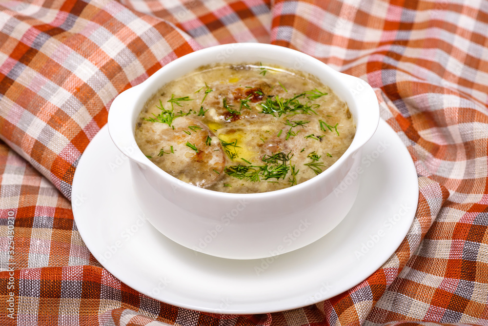 soup with mushrooms, meat and herbs. Restaurant serving soup with mushrooms, meat and herbs. Restaurant serving