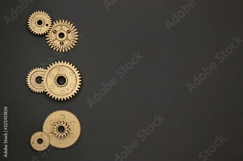 template of six golden gears on gray background