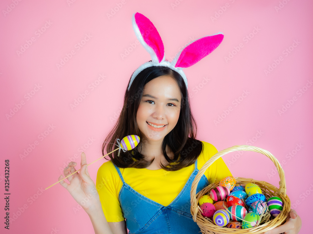 A happy young woman prepares to celebrate Easter