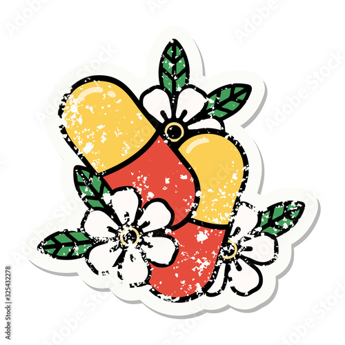 traditional distressed sticker tattoo of pills and flowers