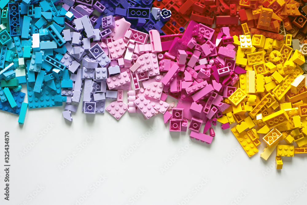 Pile of child's building blocks in multiple colours - obrazy, fototapety, plakaty 