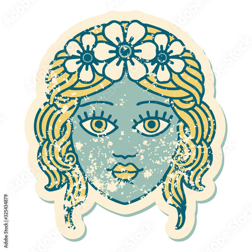 distressed sticker tattoo style icon of female face with crown of flowers