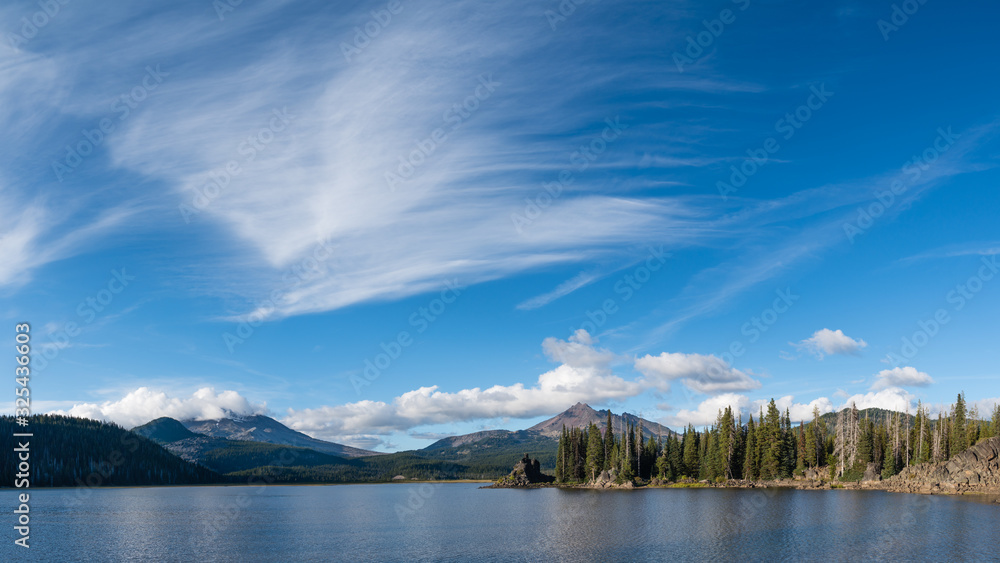 Cirrus and  Cumulus clouds form above South Sisters and Broken Top as viewed from Sparks Lake, near Bend, Oregon.