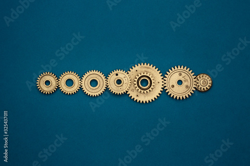 template of seven golden gears on blue background