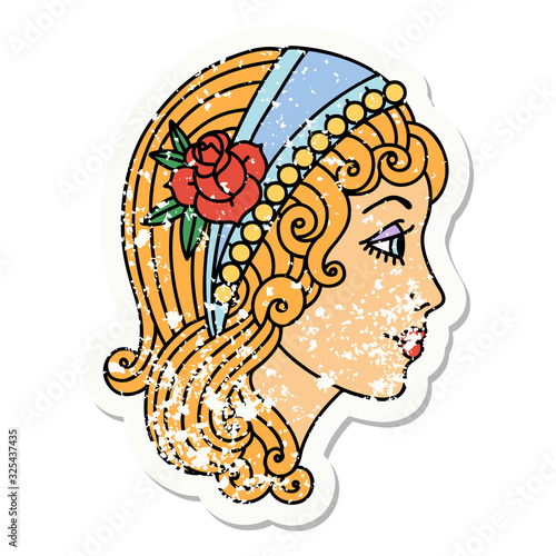 traditional distressed sticker tattoo of a gypsy head