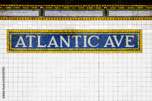 New York City Atlantic Avenue subway station with mosaic plate sign. New York City, USA name tile pattern in subway station, Manhattan metropolitan, NYC. photo