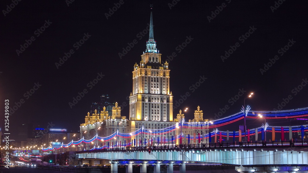 Obraz premium Hotel Ukraine winter night timelapse with bridge over Moscow River.