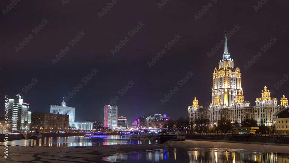 Obraz premium Hotel Ukraine winter night timelapse. Seen as reflected in the Moscow River.