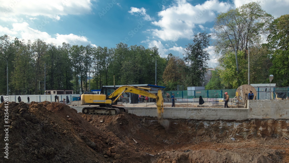 Yellow excavator on a construction site timelapse Yellow excavator on a construction site timelapse