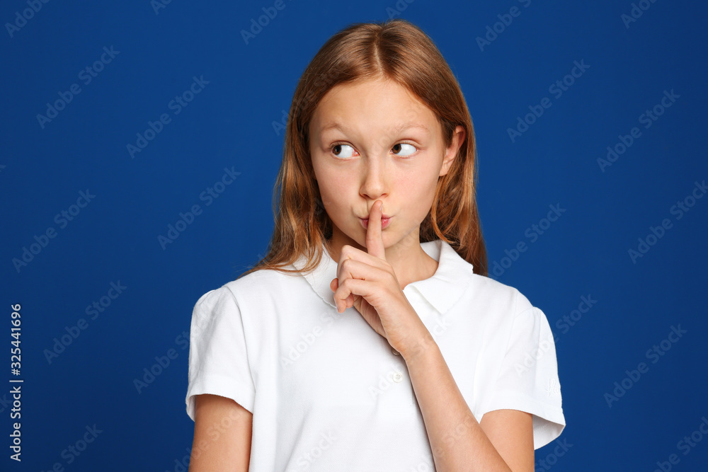 Portrait of emotional preteen girl on blue background Portrait of emotional preteen girl on blue background