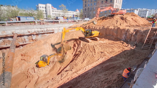 Yellow excavators at Construction of a new circular metro line. Russia, Moscow timelapse photo