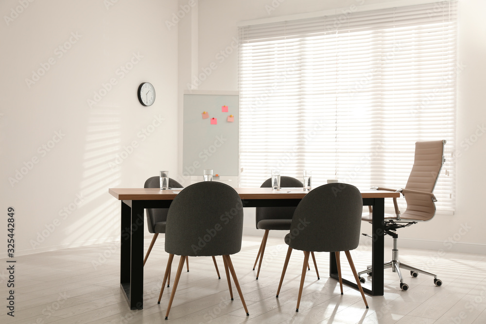 Simple office interior with large table and chairs Simple office interior with large table and chairs