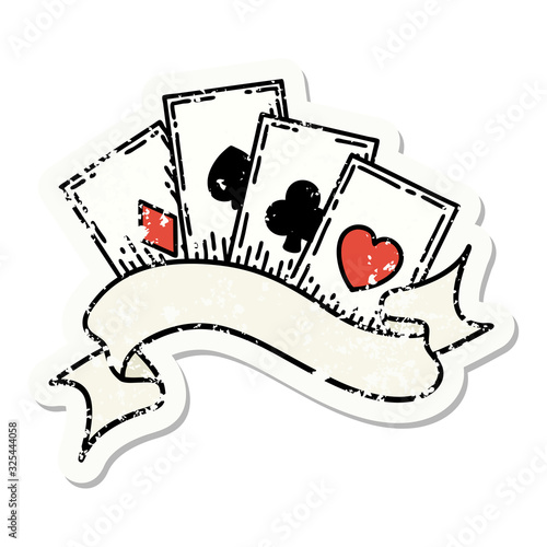 traditional distressed sticker tattoo of cards and banner