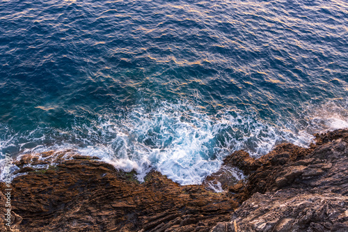Waves crushing on the cliffs as seen from above