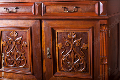 antiques, beautiful old dresser with door ornaments
