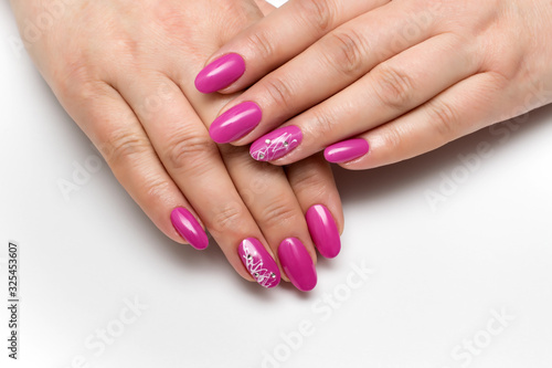 pink manicure on long oval nails with crystals and cobwebs