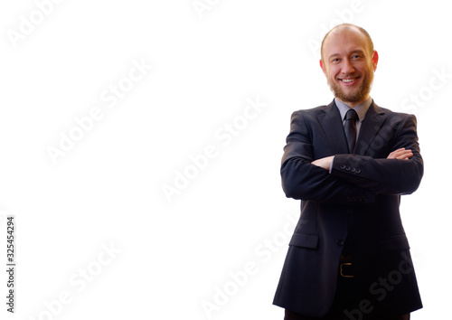 Successful businessman standing with his arms crossed. Man in a black suit, shirt and tie - the boss. Power, confidence, dominance, success, the winner. photo