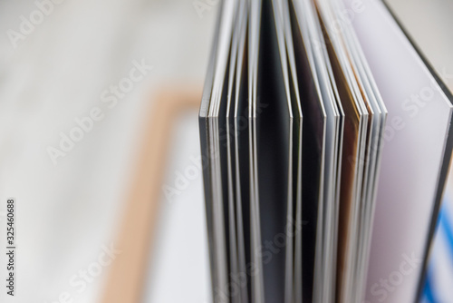 Close up of thick and rigid wedding album pages in a book with acrylic cover