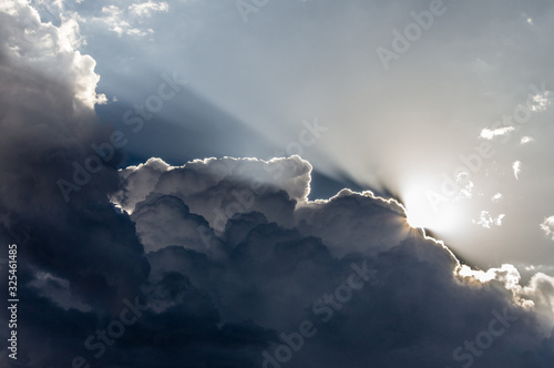 Clouds and Light. Sunlight backlights clouds with blue sky. photo