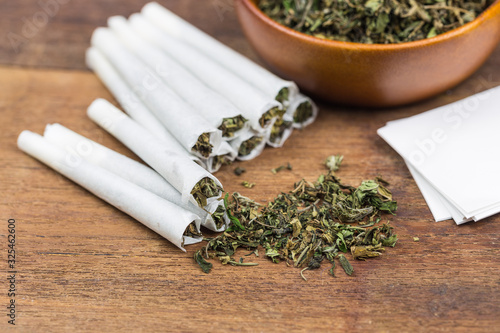 Shredded cannabis joint and a packet of weed.