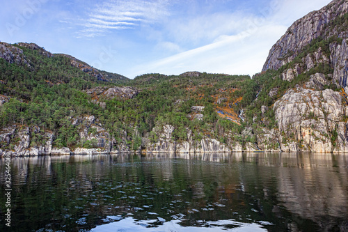 Beautiful landscape with waterfall in the Lysefjord not far from the tourist attraction Preikestolen, Rogaland, Norway