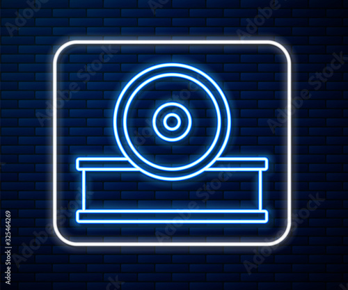 Glowing neon line Otolaryngological head reflector icon isolated on brick wall background. Equipment for inspection the patient's ear, throat and nose.  Vector Illustration