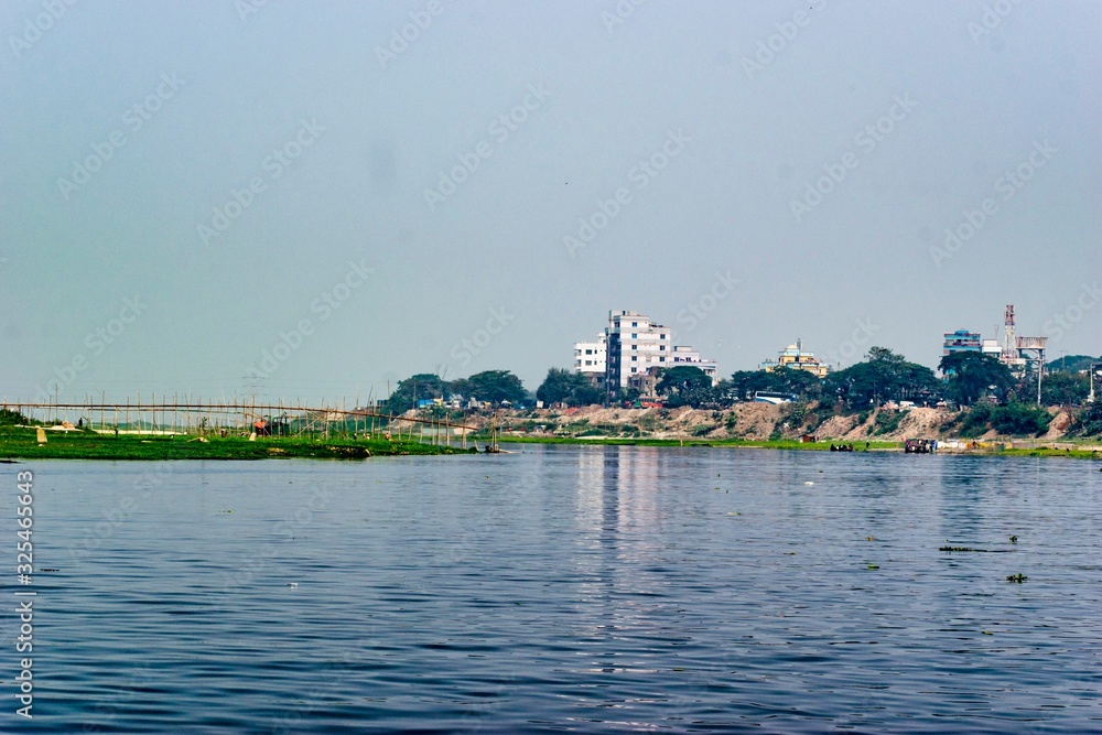 A landscape with river and buildings.