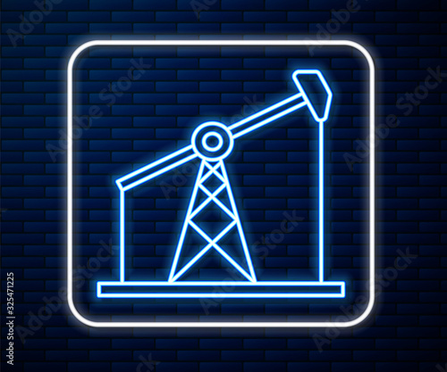 Glowing neon line Oil pump or pump jack icon isolated on brick wall background. Oil rig.  Vector Illustration