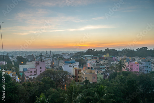 View of Sunrise Over Bangalore Neighborhood With Dense Vegetation in the Foreground