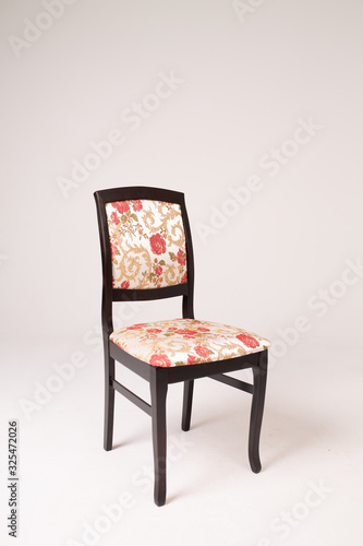 Single black chair with a soft seat on an isolated white background photo