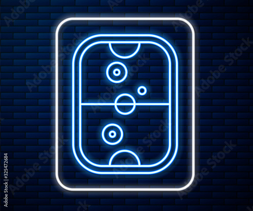 Glowing neon line Air hockey table icon isolated on brick wall background.  Vector Illustration