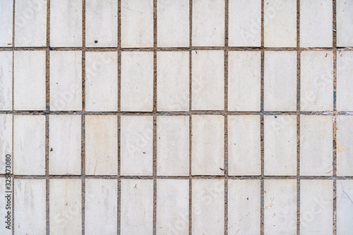 Texture of a wall covered with tiles, stock photo.