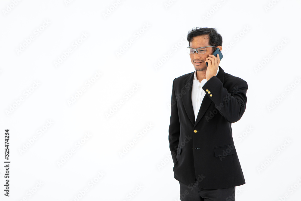 the asian business man lawyer standing and talking on mobile cellular Phone wearing formal suit isolated on white background with copy space the asian business man lawyer standing and talking on mobile cellular Phone wearing formal suit isolated on white background with copy space