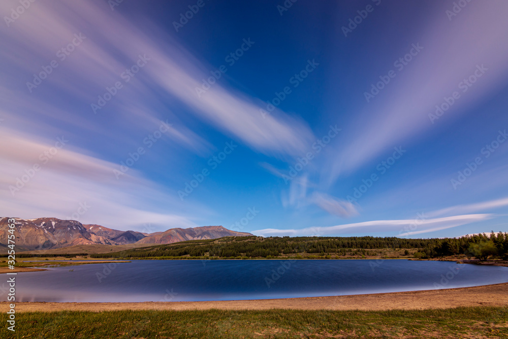 Long exposure shot during windy day in La Zeta lake against snow-capped Andes mountains, Esquel, Patagonia, Argentina