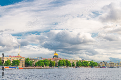 Cityscape of Saint Petersburg (Leningrad) city with row of old buildings on embankment of Neva river in historical city centre and golden dome of Saint Isaac's Cathedral background, Russia © Aliaksandr