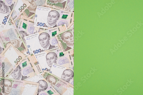 Top overhead close up view photo of real ukrainian cash and place for design text isolated background