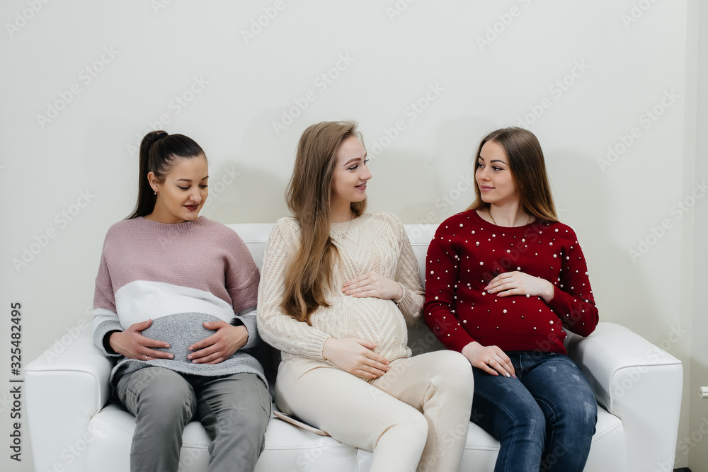 Pregnant girls are waiting for the doctor in the waiting room Pregnant girls are waiting for the doctor in the waiting room