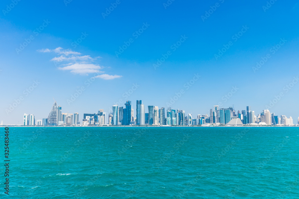 Naklejka premium The skyline of West Bay with numerous modern fast growing skyscrapers of Al Dafna, Doha, Qatar.