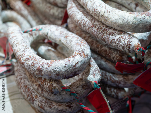 rustic fuet sausages in a buchery in spain photo