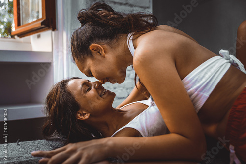 Fototapeta Lesbian couple at home