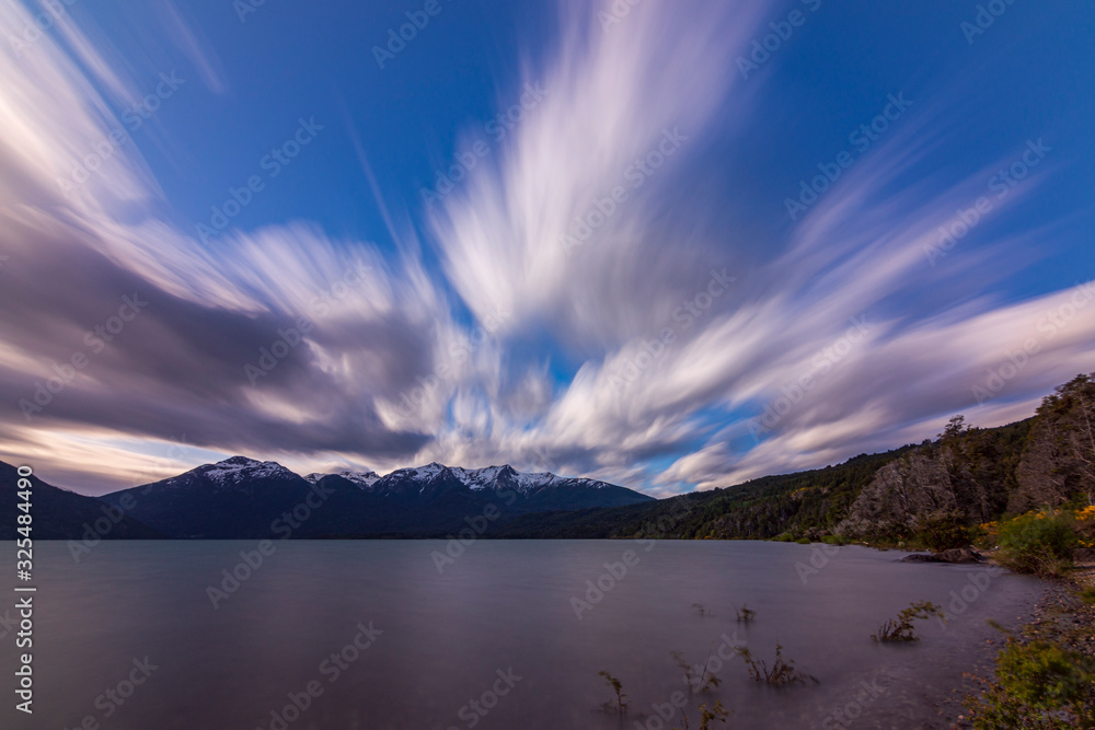 Long exposure shot during windy day in Futalaufquen lake against snow-capped Andes mountains, Los Alerces National Park, Patagonia, Argentina Long exposure shot during windy day in Futalaufquen lake against snow-capped Andes mountains, Los Alerces National Park, Patagonia, Argentina