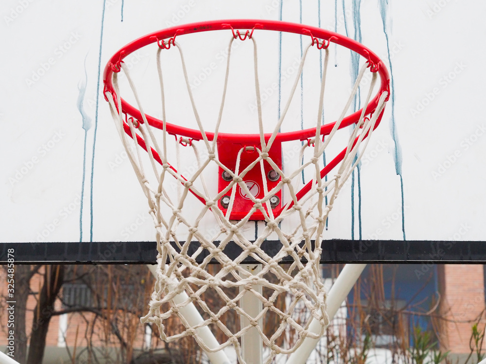 street basketball basket with graffiti
