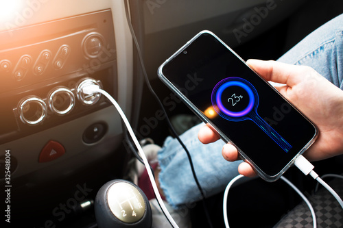 Wallpaper Mural The phone is charging from the car. Torontodigital.ca