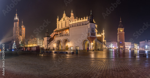 Krakow, Poland, panorama of Main Square with Cloth Hall, St Mary's church and Town Hall tower in the night
