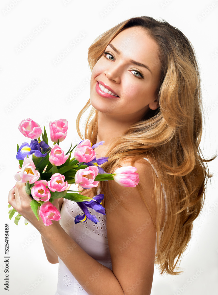Woman with Spring Flower bouquet. Happy surprised model woman smelling flowers. Mother's Day. Springtime Woman with Spring Flower bouquet. Happy surprised model woman smelling flowers. Mother's Day. Springtime