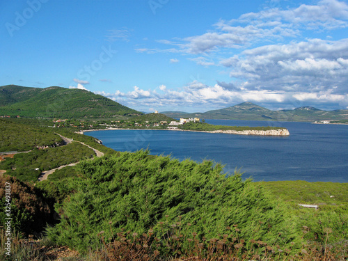 Sardinia lake view in Italy Italia during summer time with clouds and mountains photo