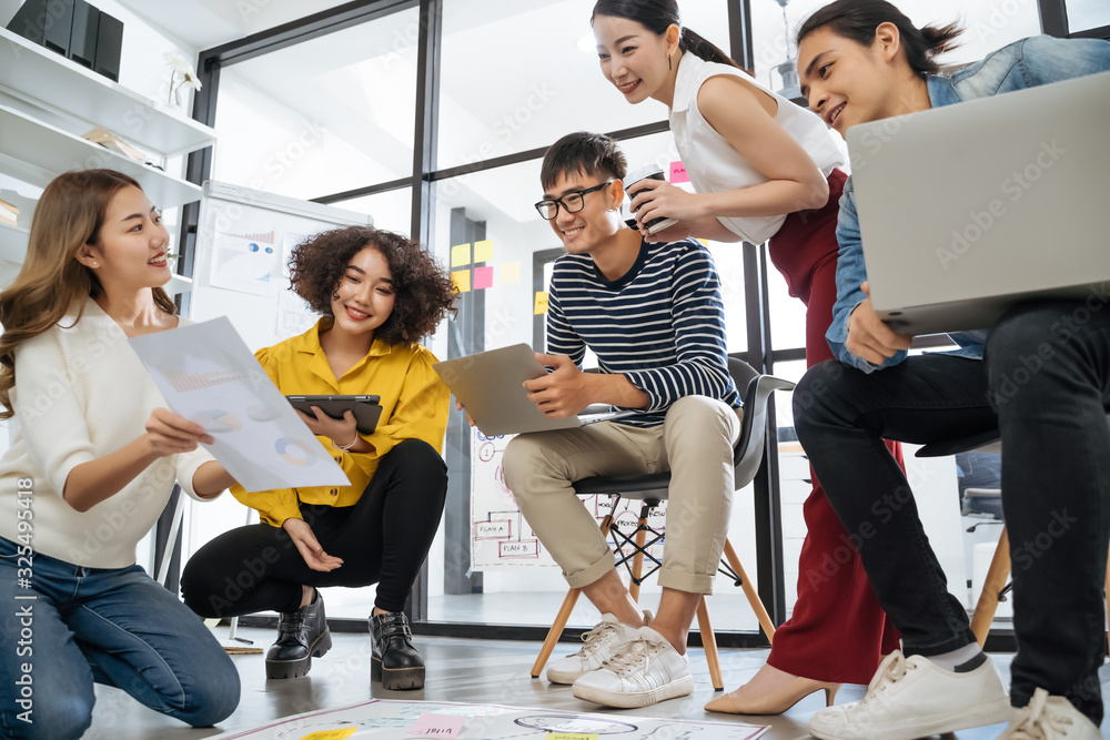 © saksit - Asian creative team sitting and working sharing creative ideas inspire in workshop together. Business people are meeting at creative office workplace. © saksit - Asian creative team sitting and working sharing creative ideas inspire in workshop together. Business people are meeting at creative office workplace.